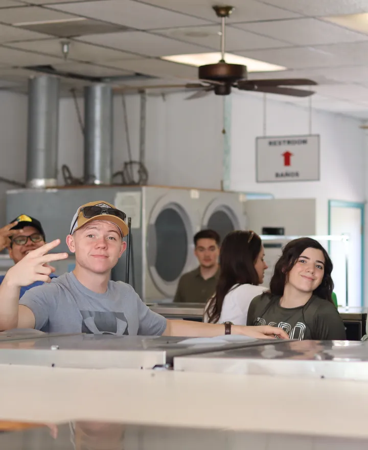 HTSM students doing laundry together on campus